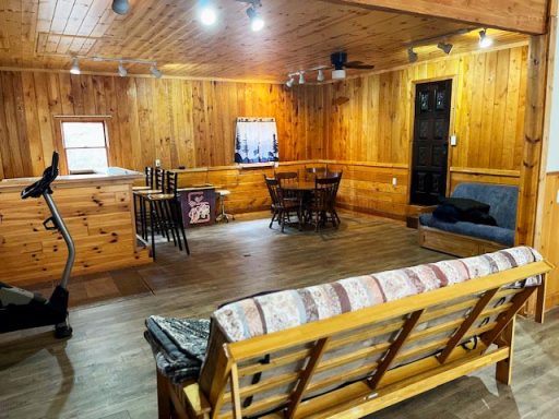 Recreation Room with Futon and Tables Image