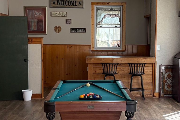 Game room and bar Pool Table in the Game Room and Bar Area Image